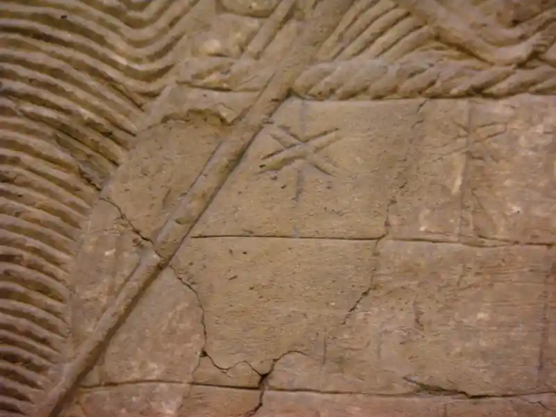 Four-pointed cross on the gypsum wall panel relief for Sennacherib's palace